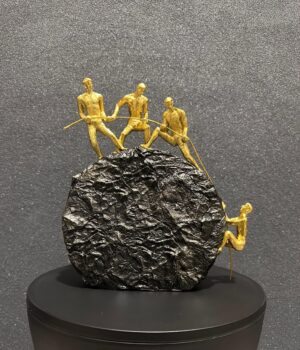 4 Persons Climbing on The Rock