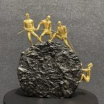 4 Persons Climbing On The Rock