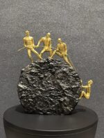 4 Persons Climbing On The Rock